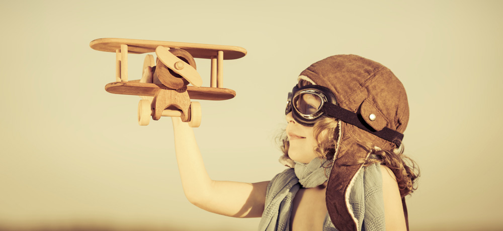child playing with plane